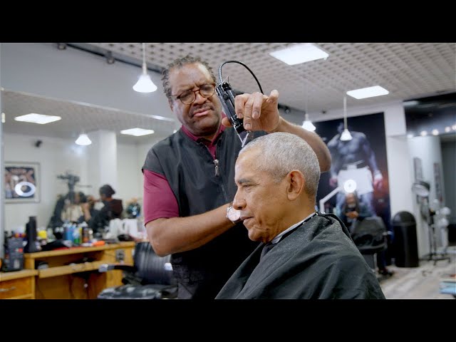 President Obama drops by his old barbershop for a haircut