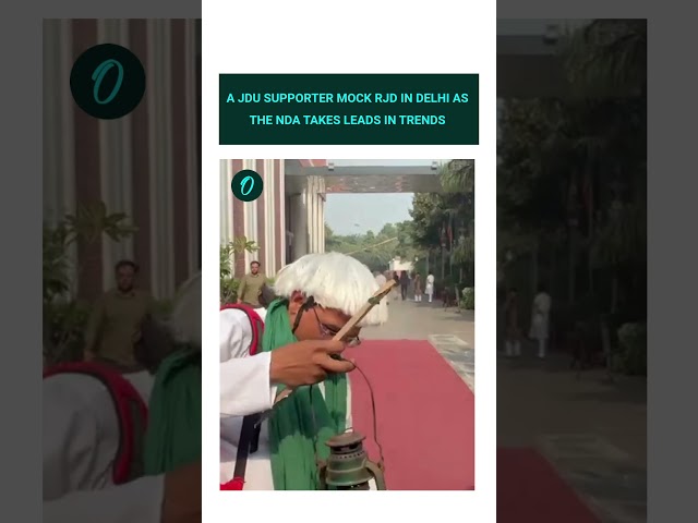 A JDU supporter mock RJD in Delhi as the NDA takes leads in trends.