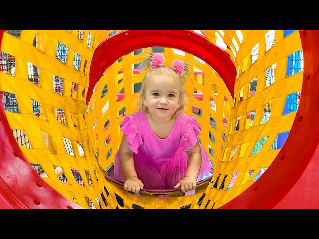 Alice and Mom play in the Game Center for kids