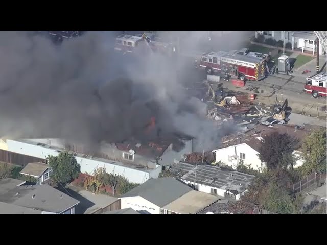 Crews battling large building fire with smoke after reported explosion in Hayward