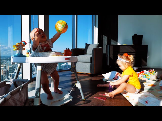 The sweet little ones, Naomi and David, are happily playing at home.