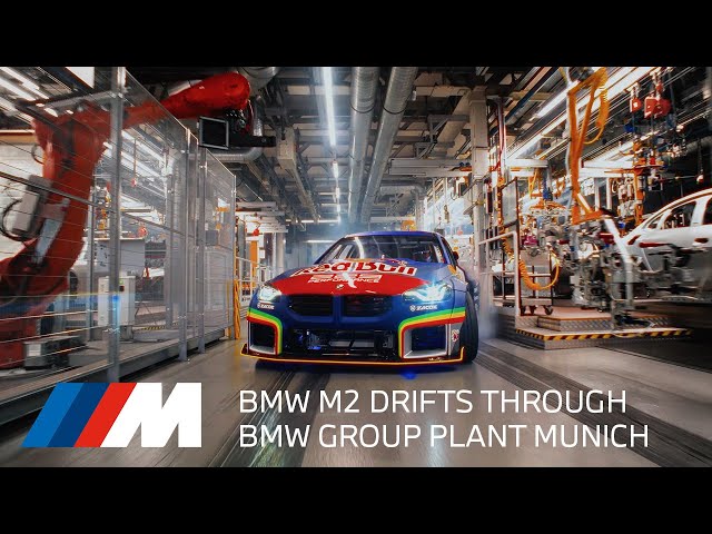 BMW M2 drifts through the BMW Group Plant Munich. Red Bull Germany x BMW M.