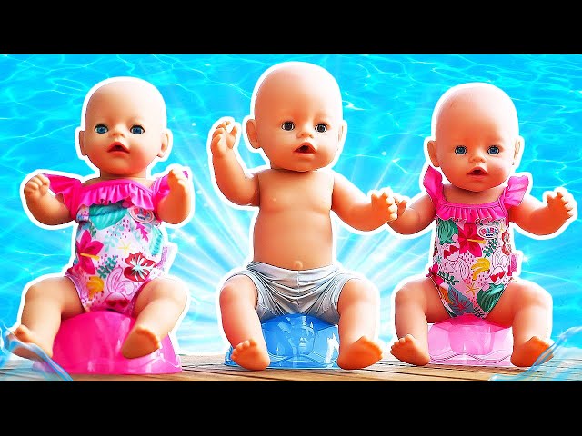 Maya helps her baby doll pack for summer camp - clothes, a baby bottle, shoes, and toys for the doll