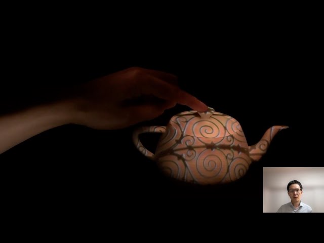 Shadowless Projection Mapping using Retrotransmissive Optics