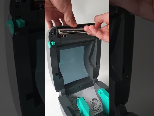 If Zebra GK420 print is smudged fix - Clean these black marks at the back of printhead